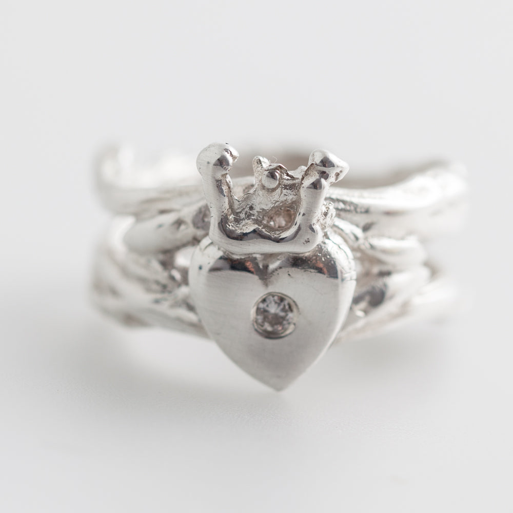 Double Claddag ring with silver and a stone.